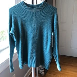 Blue sweater.